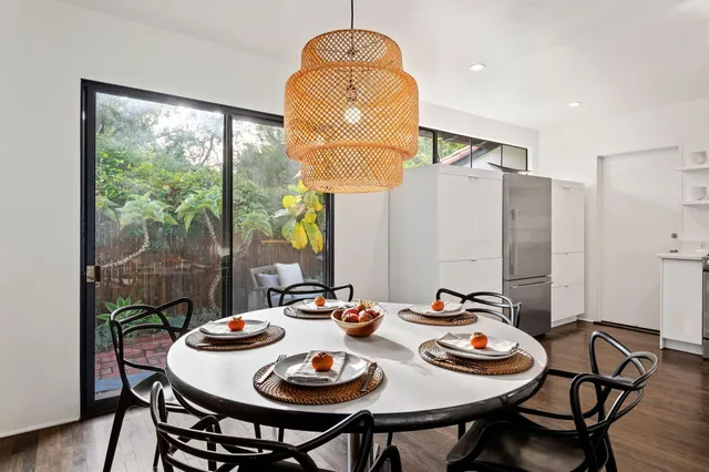 a view of a dining room with furniture window and outside view