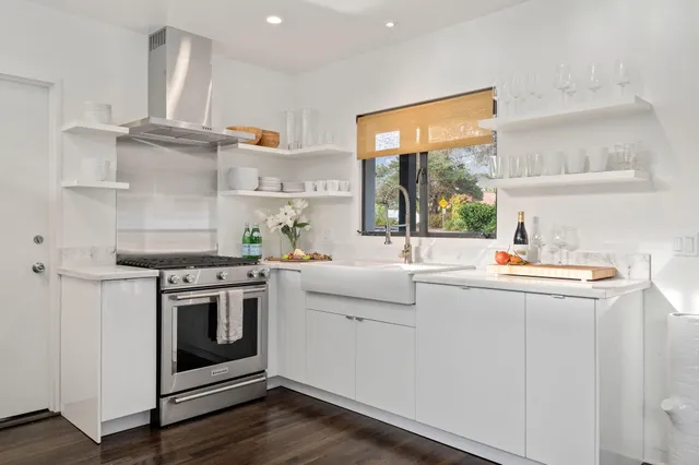 a kitchen with a stove and a sink