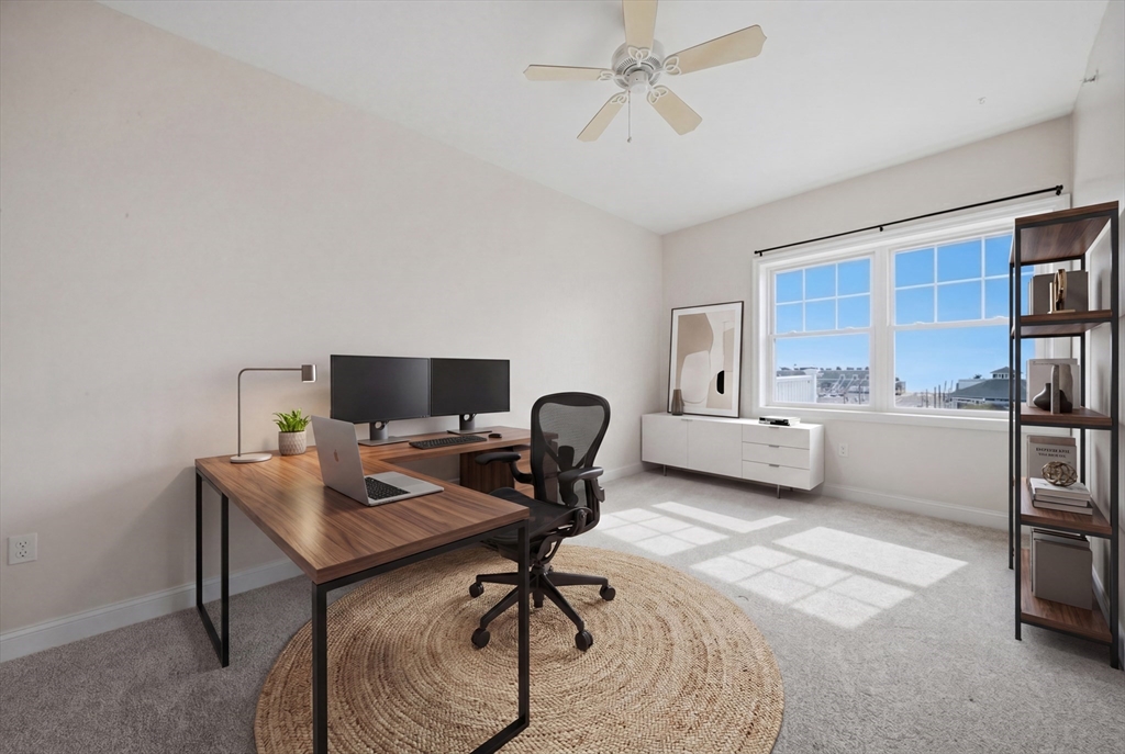 233 Beach Road, Unit A11 Salisbury, MA 01952 - Photo 17 of 37 a workspace with furniture and a window