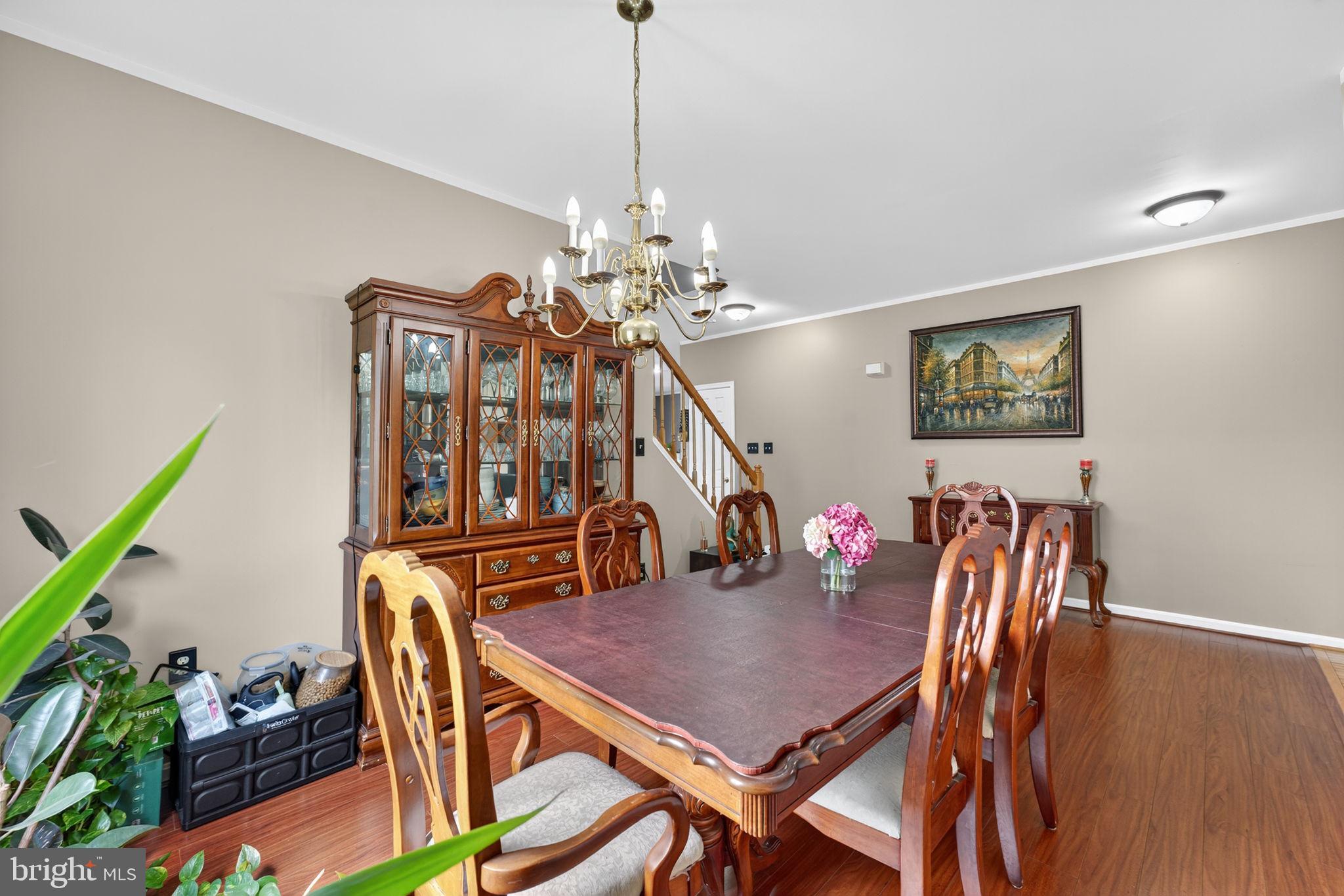 751 Holly Leaf Road Culpeper, VA 22701 - Photo 12 of 65 a view of a dining room with furniture and wooden floor