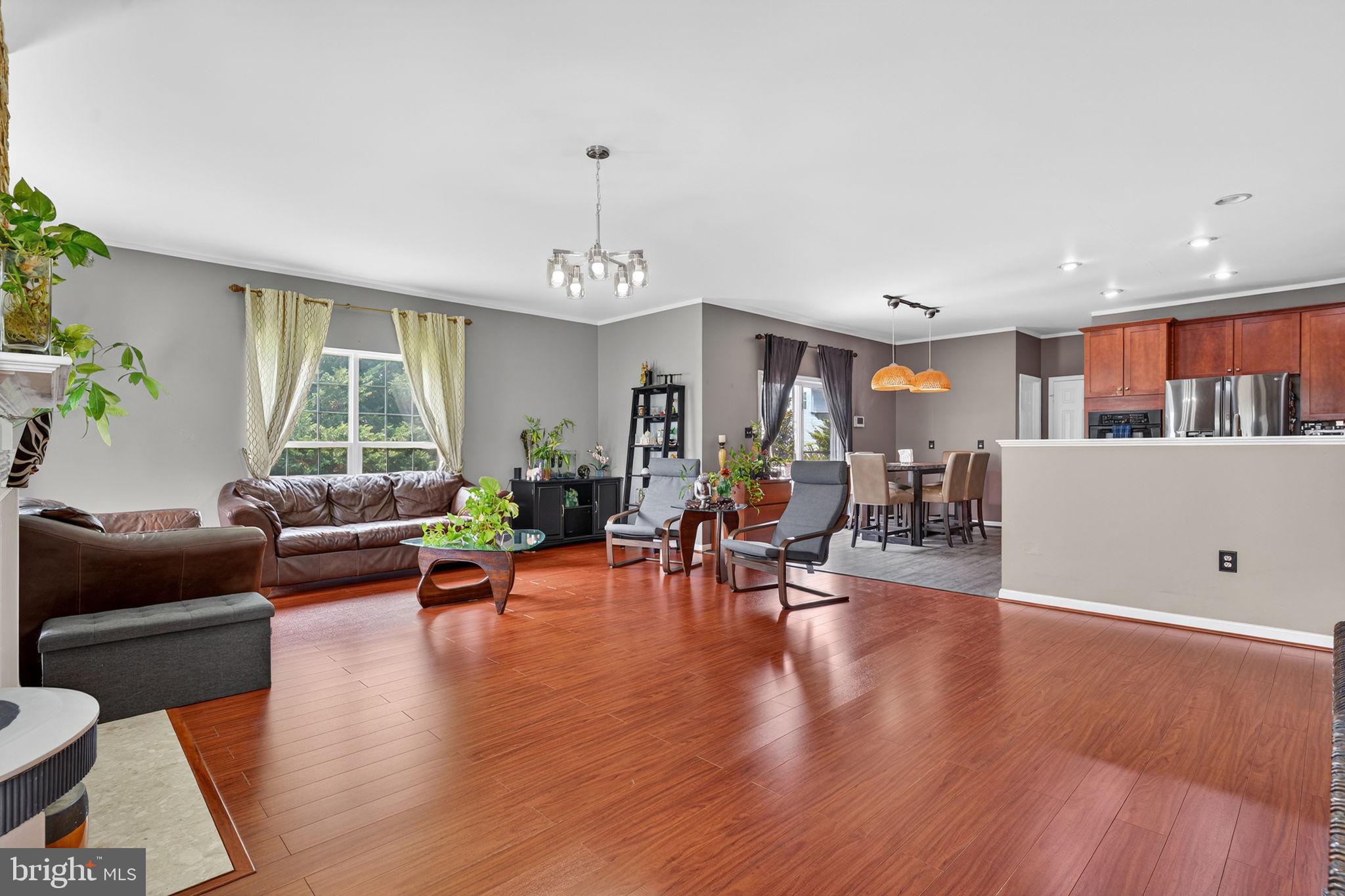 751 Holly Leaf Road Culpeper, VA 22701 - Photo 15 of 65 a living room with furniture and a large window