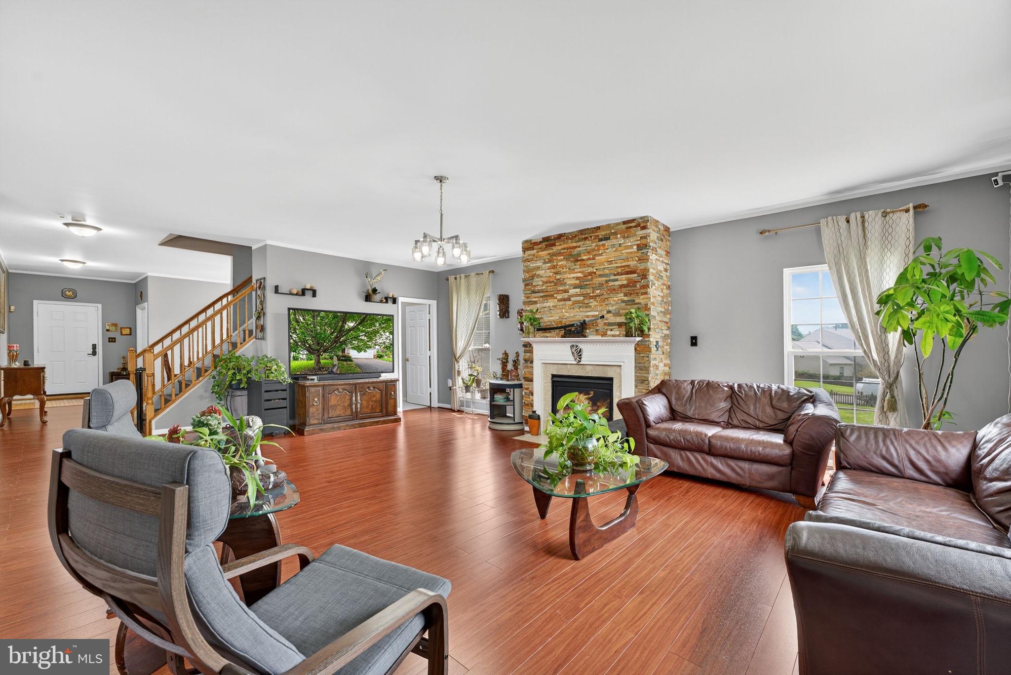 751 Holly Leaf Road Culpeper, VA 22701 - Photo 17 of 65 a living room with furniture and a fireplace