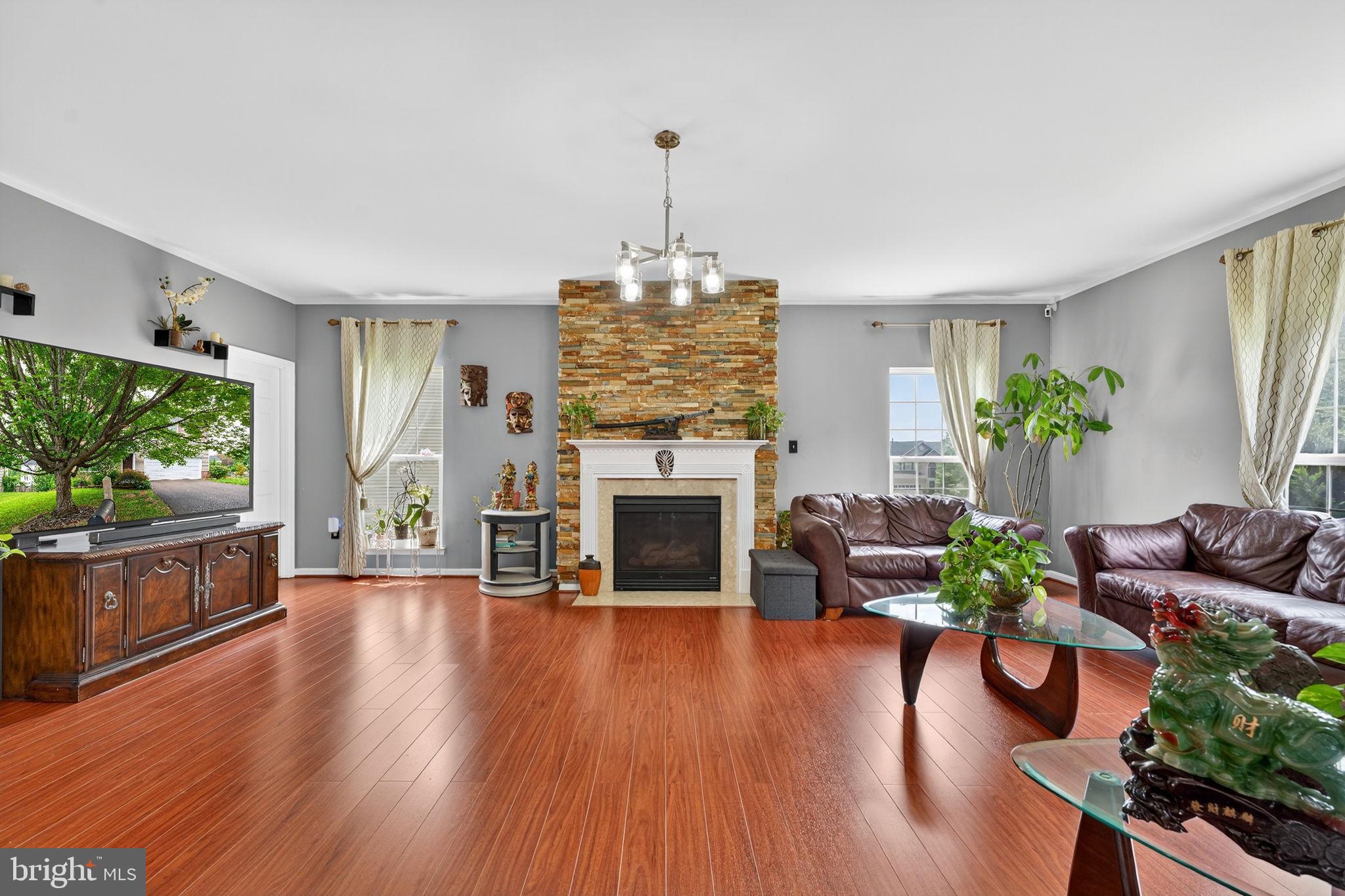 751 Holly Leaf Road Culpeper, VA 22701 - Photo 25 of 65 a living room with furniture fireplace and flat screen tv