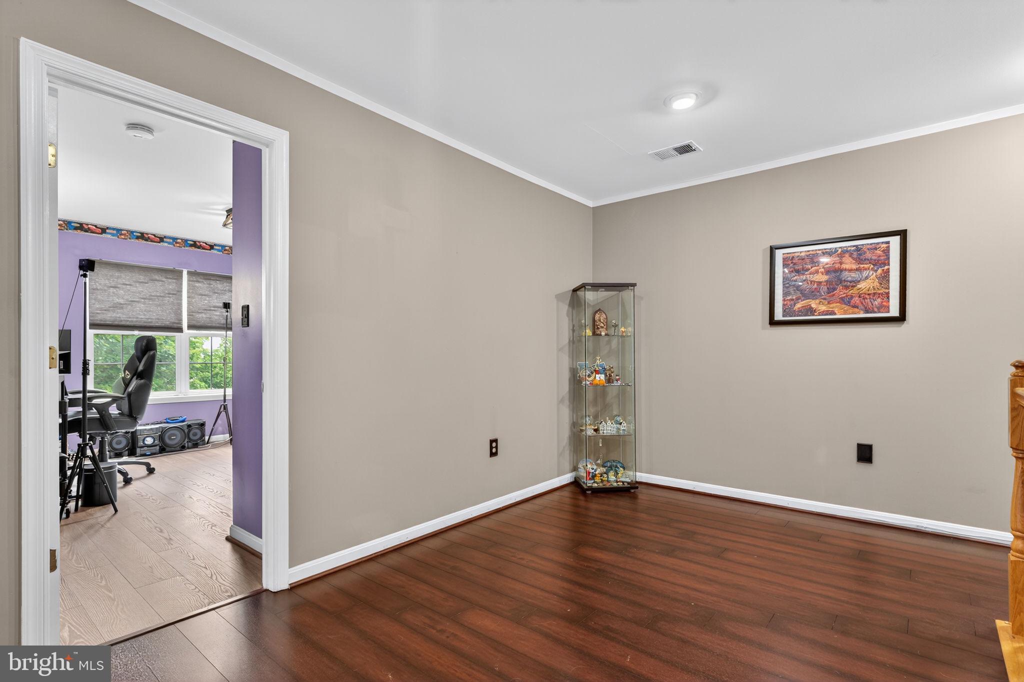 751 Holly Leaf Road Culpeper, VA 22701 - Photo 31 of 65 a view of empty room with wooden floor