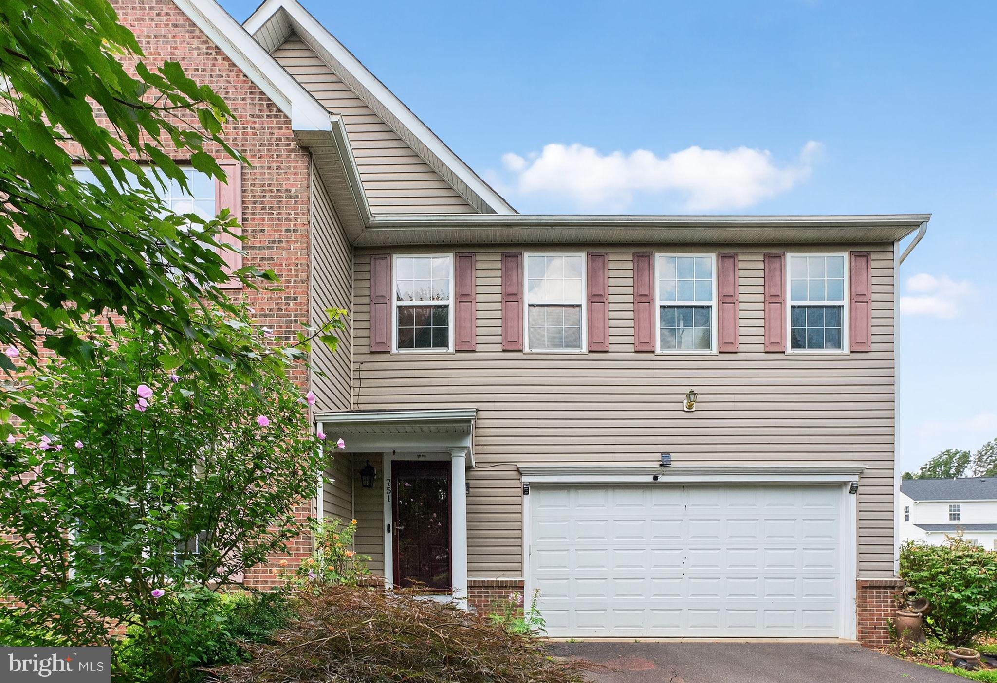 751 Holly Leaf Road Culpeper, VA 22701 - Photo 4 of 65 a front view of a house with garage