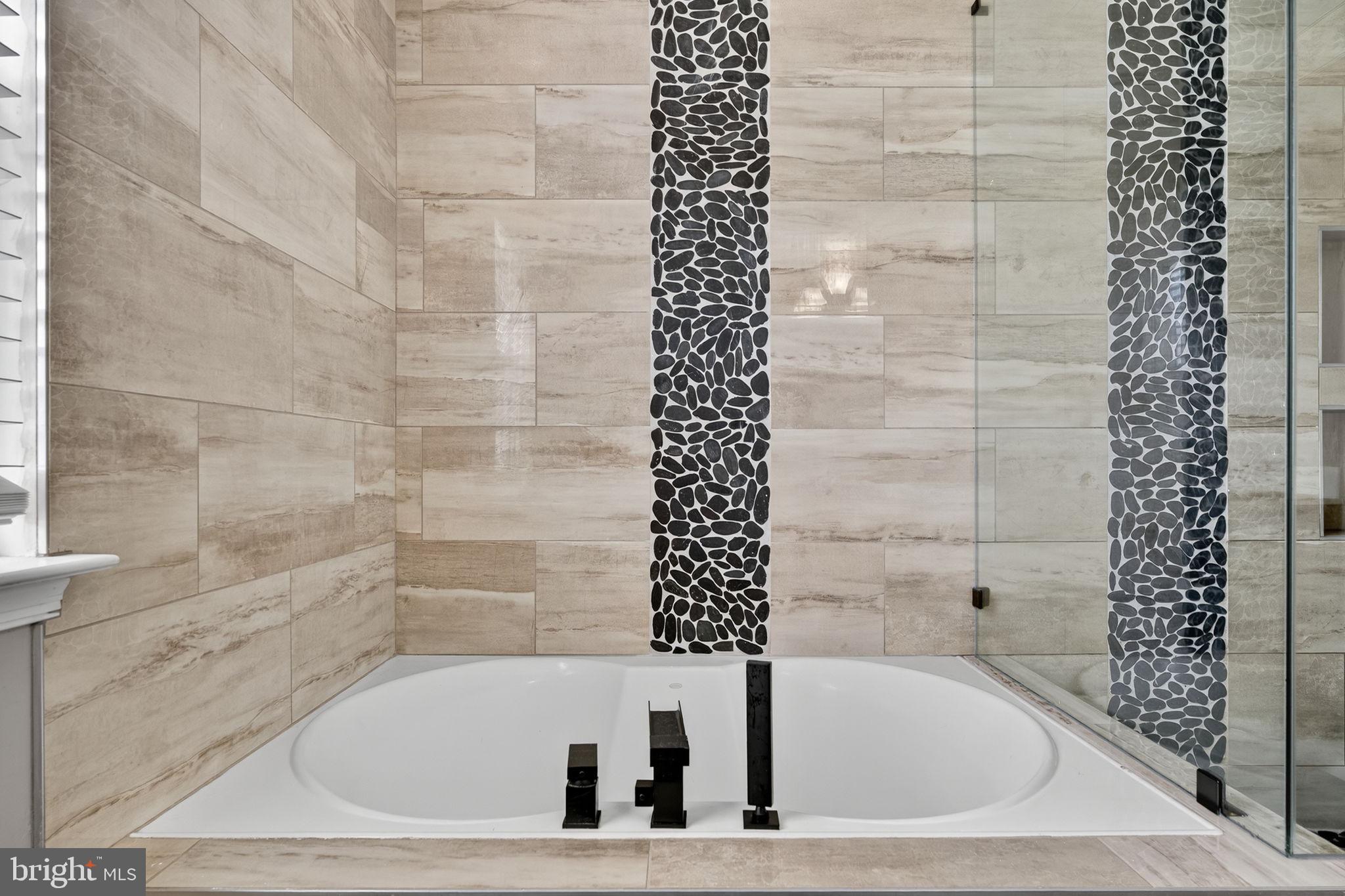 751 Holly Leaf Road Culpeper, VA 22701 - Photo 42 of 65 a white bath tub sitting next to a white sink