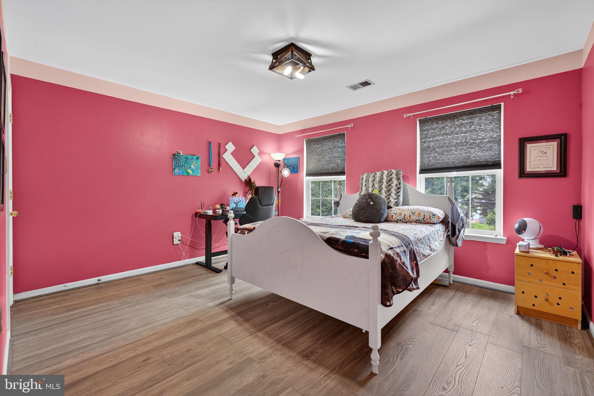 751 Holly Leaf Road Culpeper, VA 22701 - Photo 45 of 65 a bed room with a bed and a chair