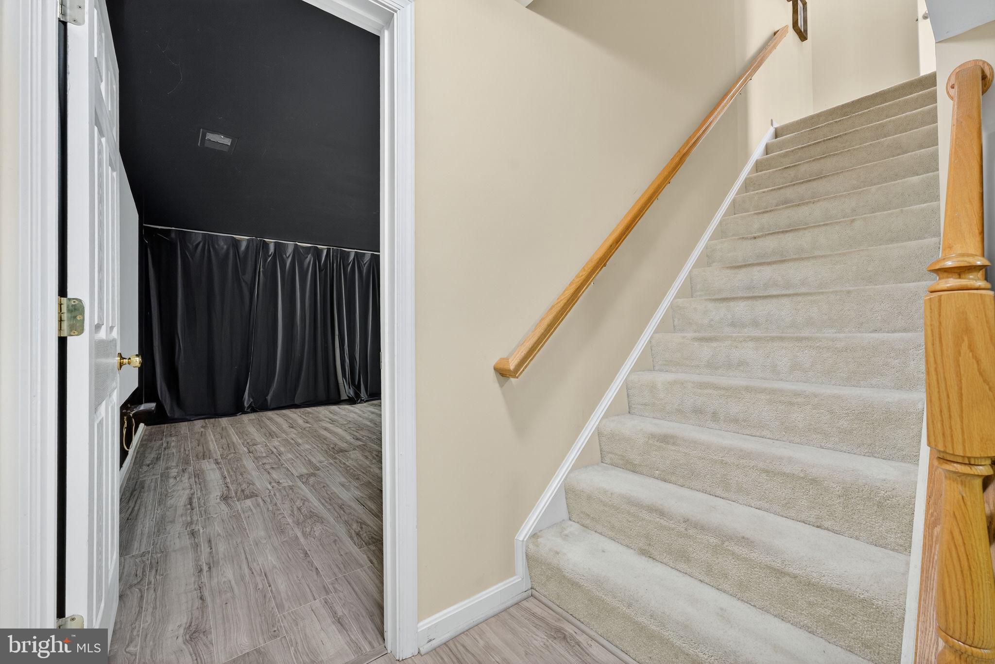 751 Holly Leaf Road Culpeper, VA 22701 - Photo 50 of 65 a view of staircase with wooden floor and white walls