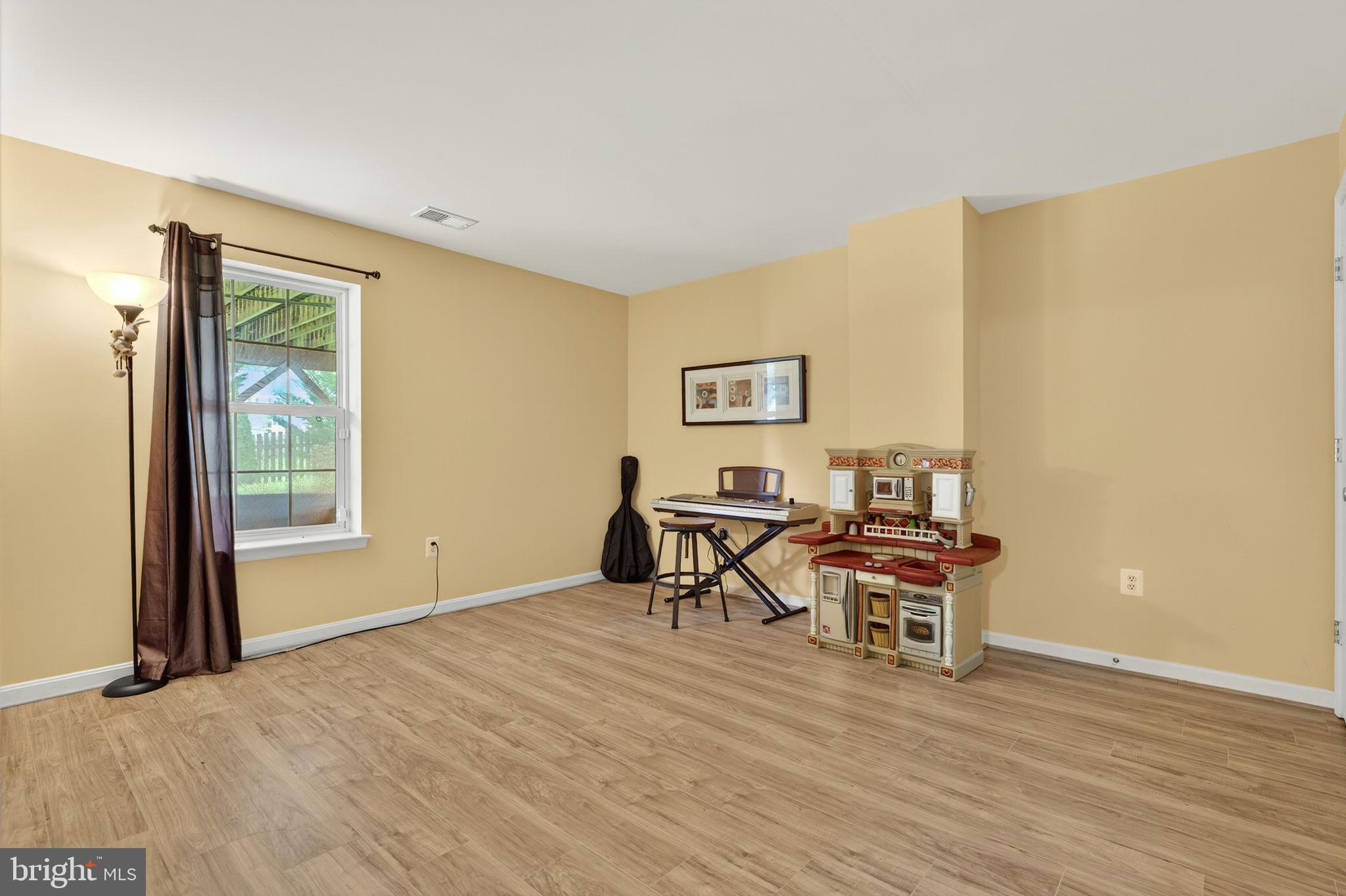 751 Holly Leaf Road Culpeper, VA 22701 - Photo 53 of 65 a view of a livingroom with furniture and wooden floor