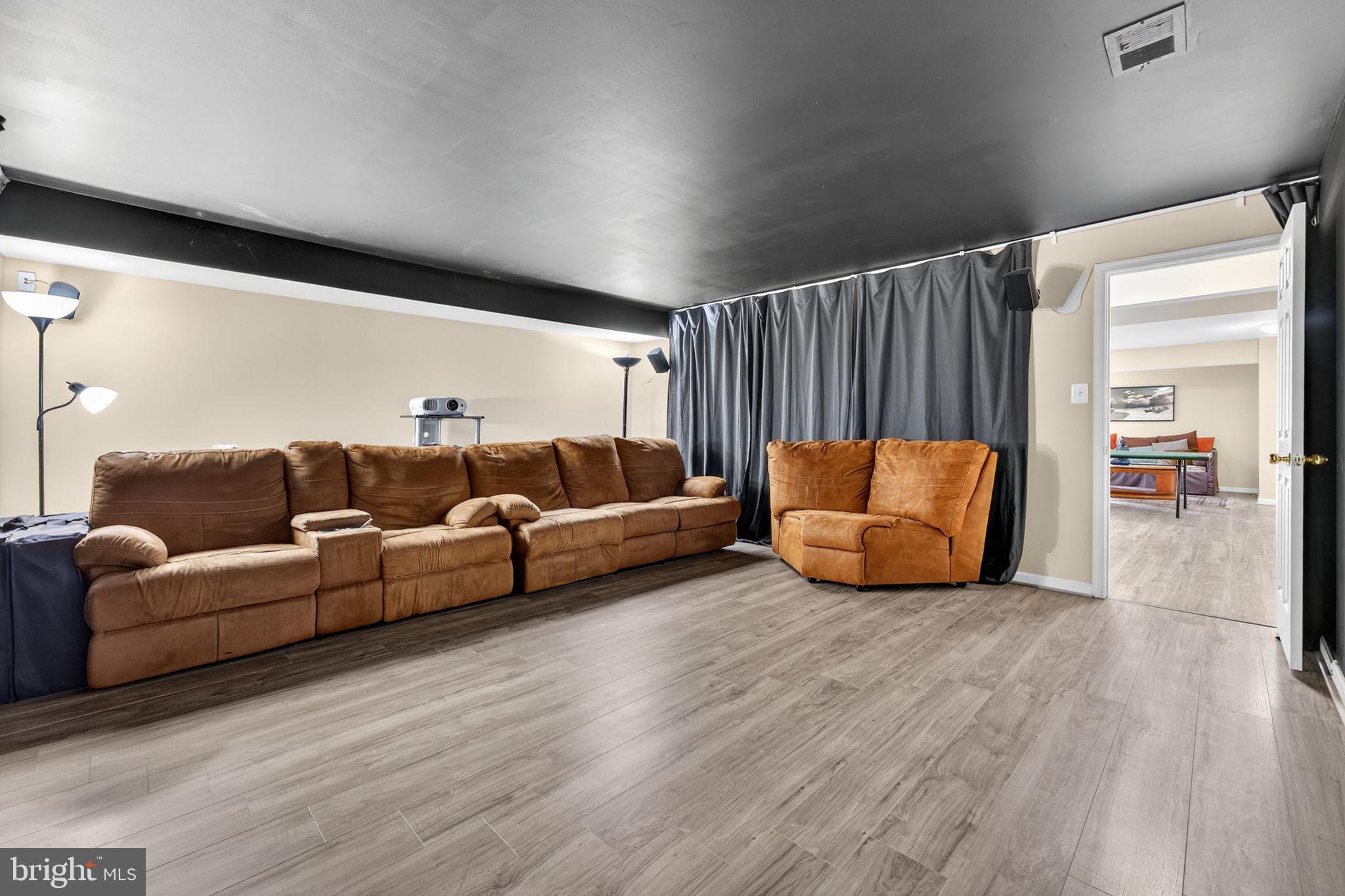 751 Holly Leaf Road Culpeper, VA 22701 - Photo 55 of 65 a living room with furniture and a wooden floor
