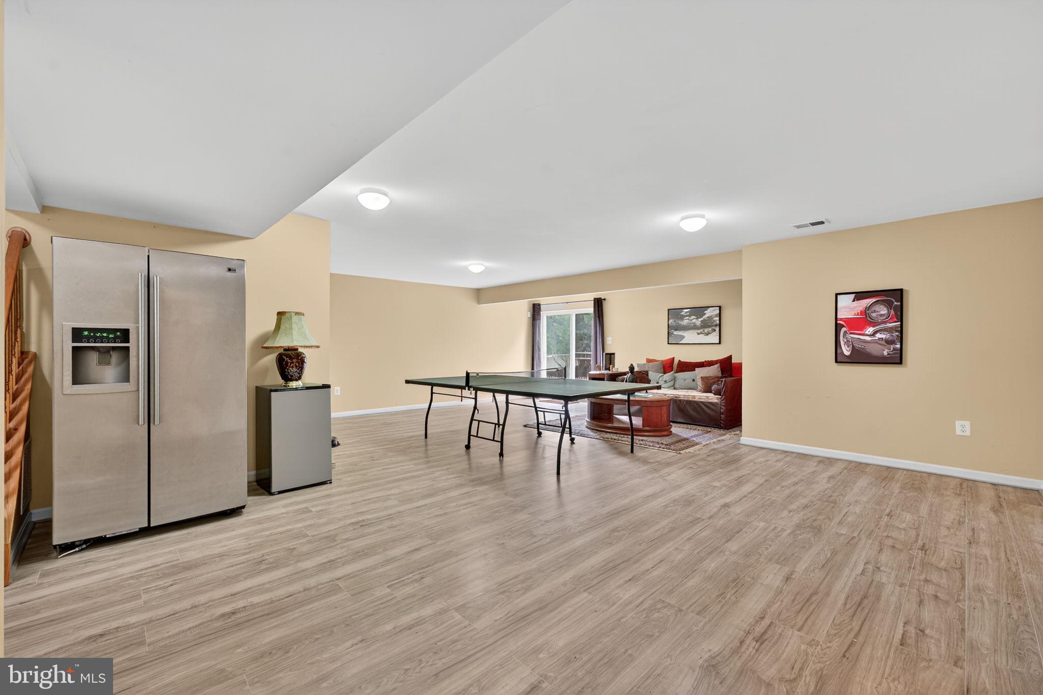 751 Holly Leaf Road Culpeper, VA 22701 - Photo 56 of 65 a living room with furniture and a wooden floor