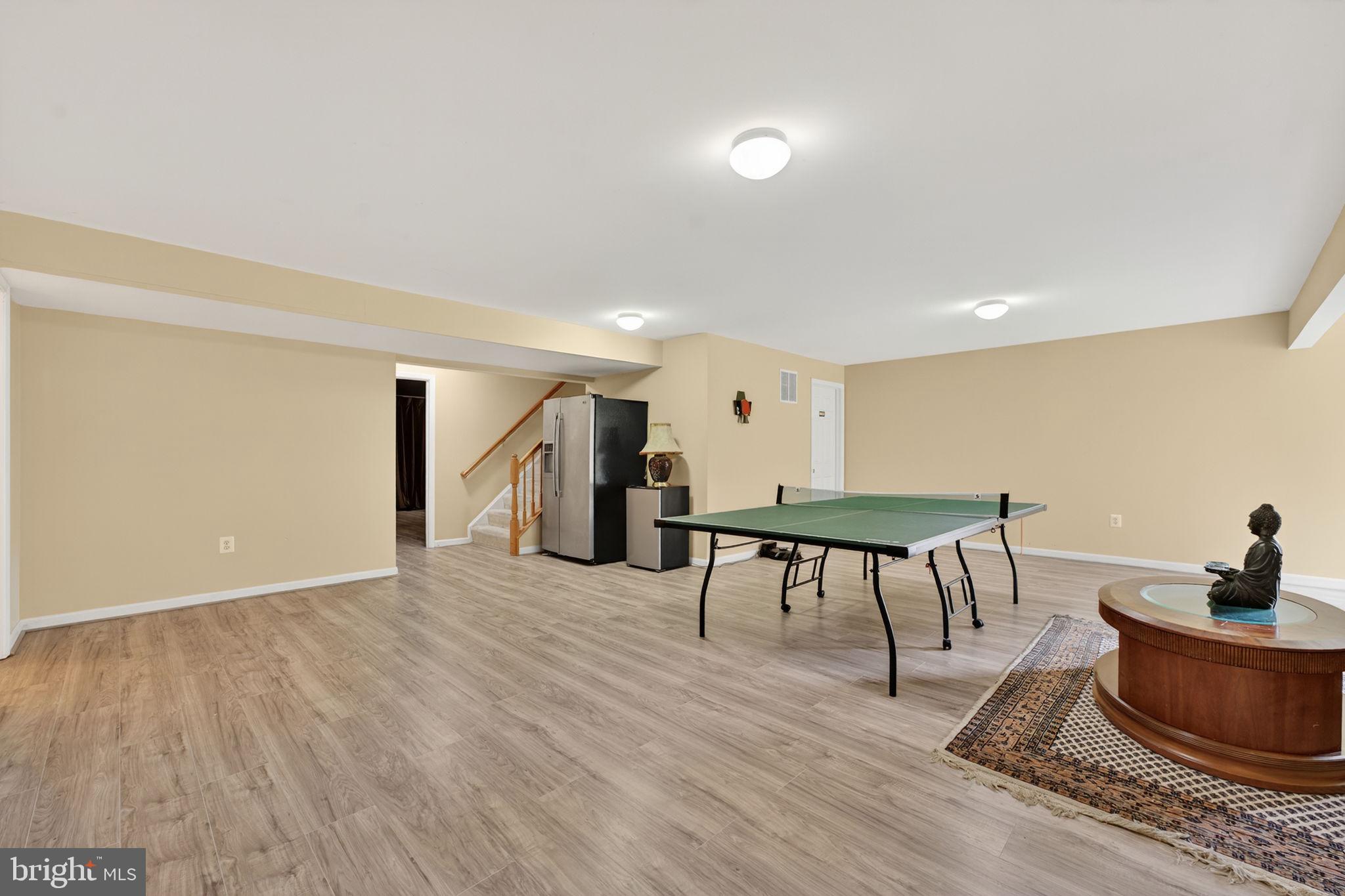 751 Holly Leaf Road Culpeper, VA 22701 - Photo 57 of 65 a living room with furniture and a wooden floor