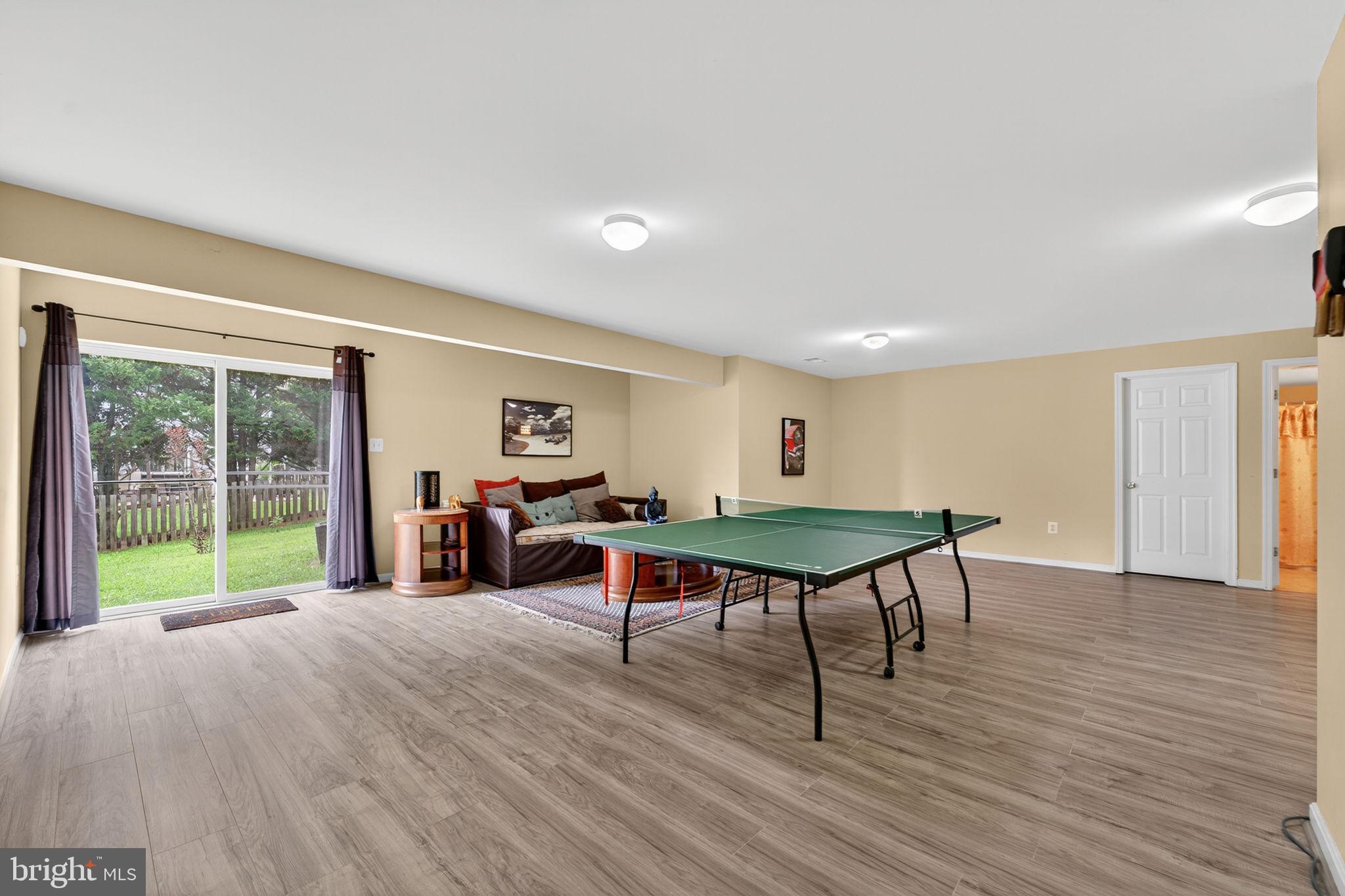 751 Holly Leaf Road Culpeper, VA 22701 - Photo 58 of 65 a living room with furniture a table and a large window