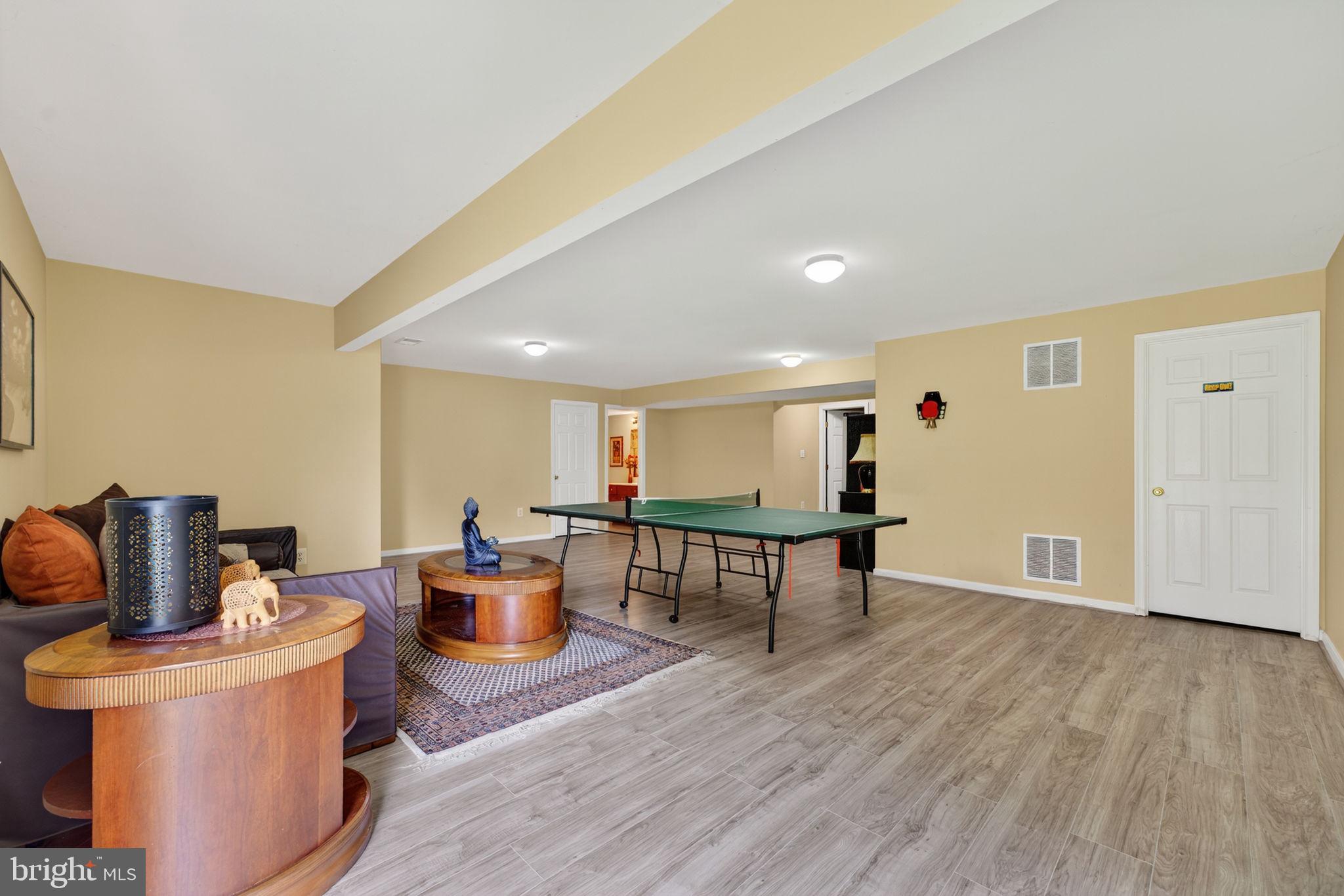 751 Holly Leaf Road Culpeper, VA 22701 - Photo 59 of 65 a living room with furniture and wooden floor