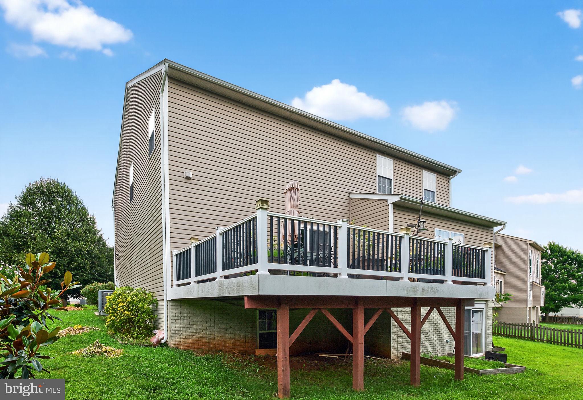 751 Holly Leaf Road Culpeper, VA 22701 - Photo 62 of 65 a balcony with table and chairs