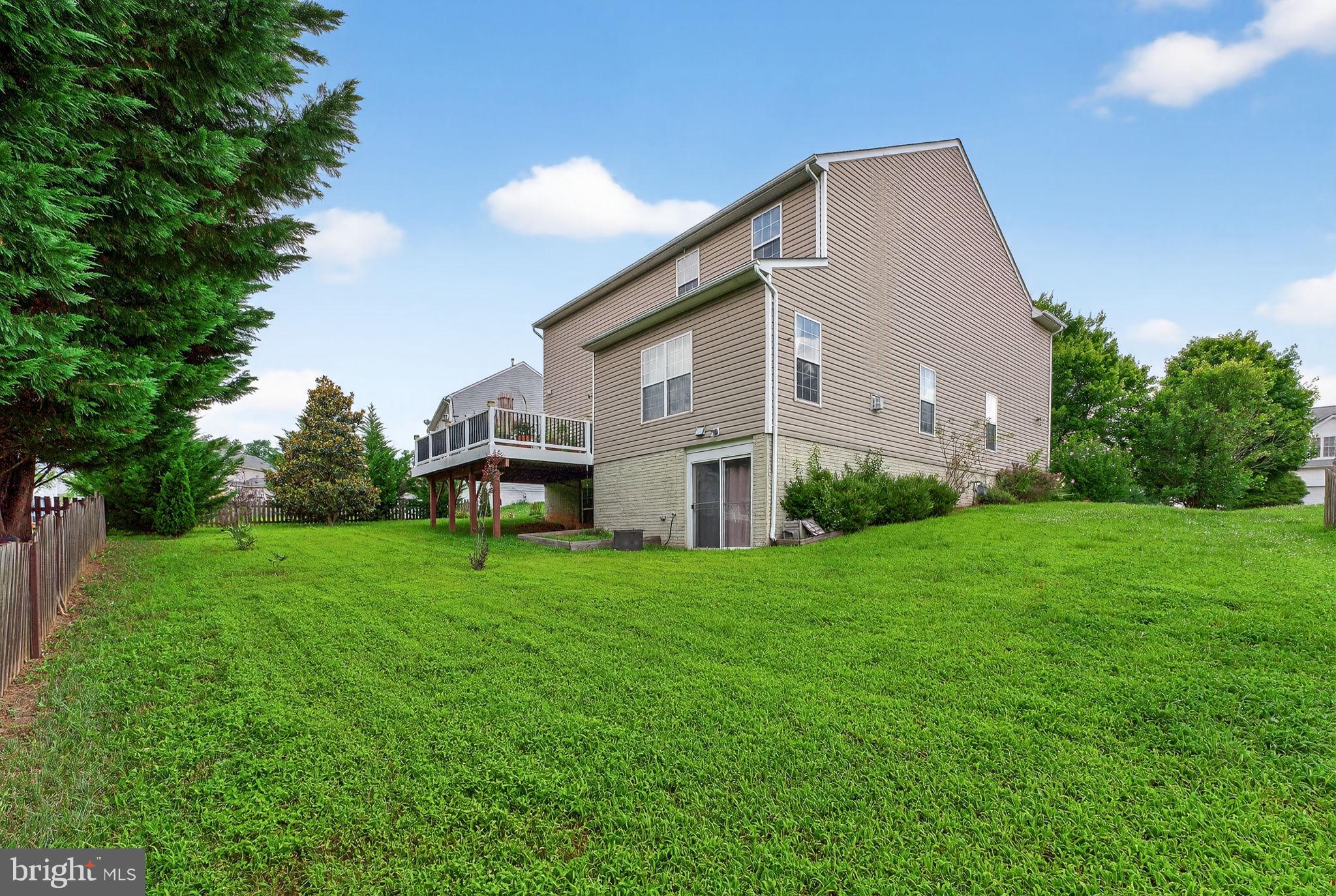 751 Holly Leaf Road Culpeper, VA 22701 - Photo 65 of 65 a front view of a house with garden