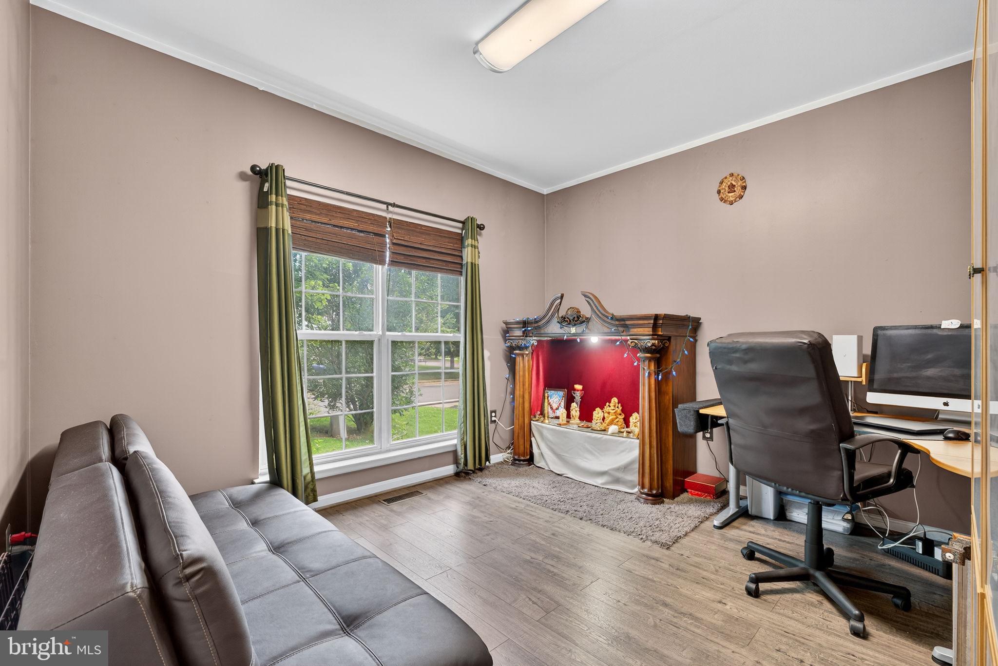 751 Holly Leaf Road Culpeper, VA 22701 - Photo 10 of 65 a view of a workspace with furniture and a window