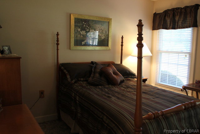 882 Pine Hall Road Mathews, VA 23109 - Photo 20 of 26 a bedroom with a bed and a window