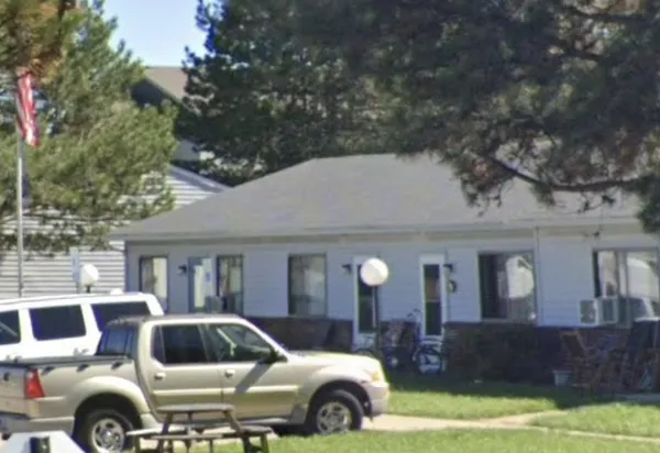a front view of a house with parking space