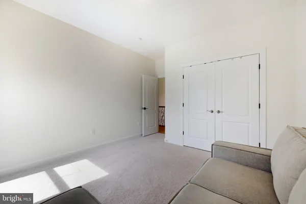 a bedroom with a bed and a television