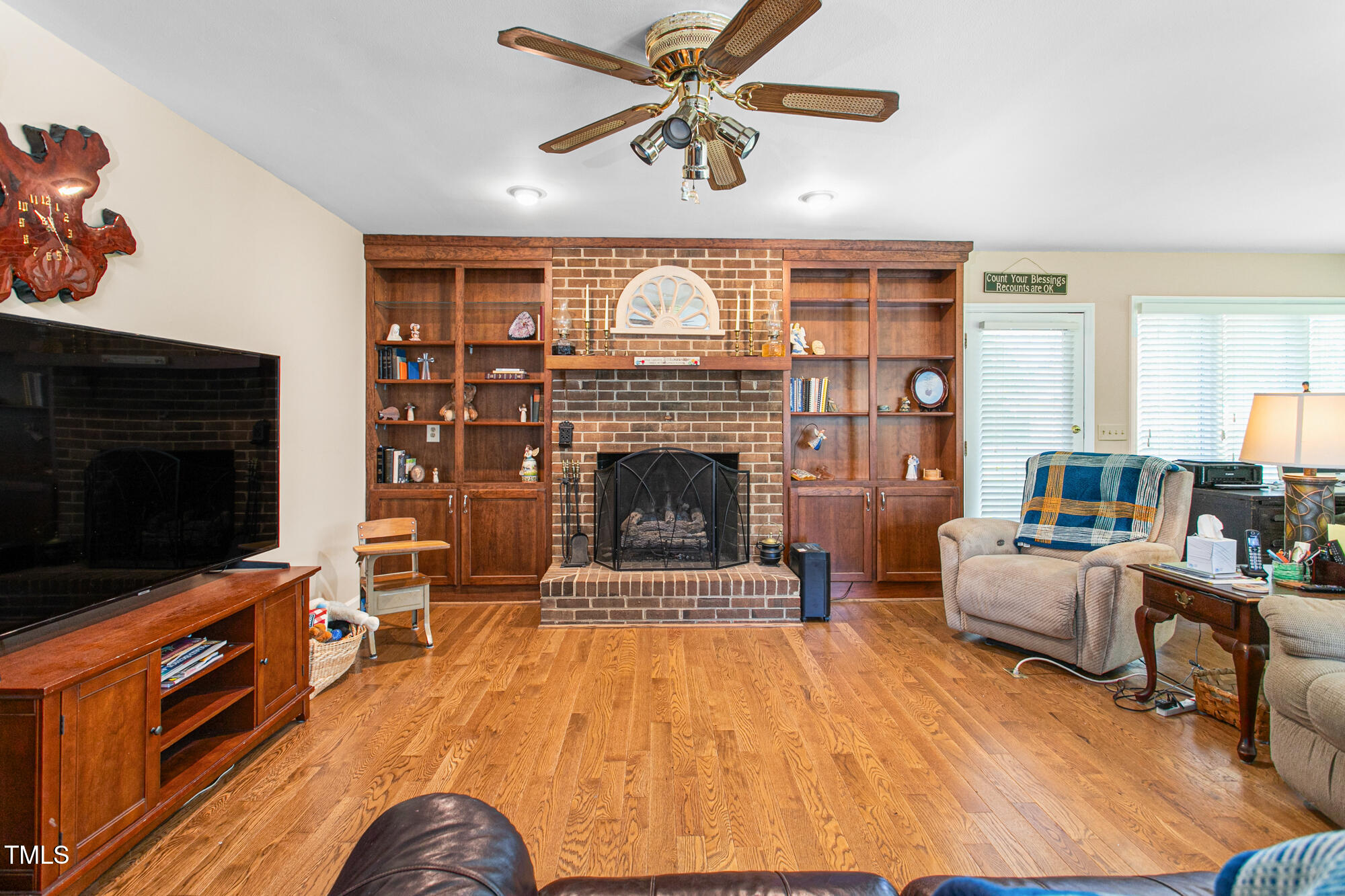 809 Brookview Drive Elon, NC 27244 - Photo 9 of 53 a living room with furniture and a fireplace