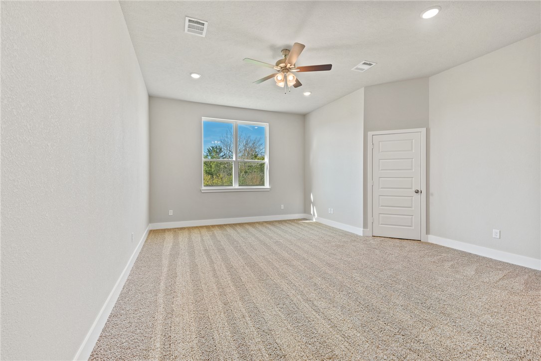 4245 Appalachian Trail Bryan, TX 77802 - Photo 22 of 30 wooden floor in an empty room with a window