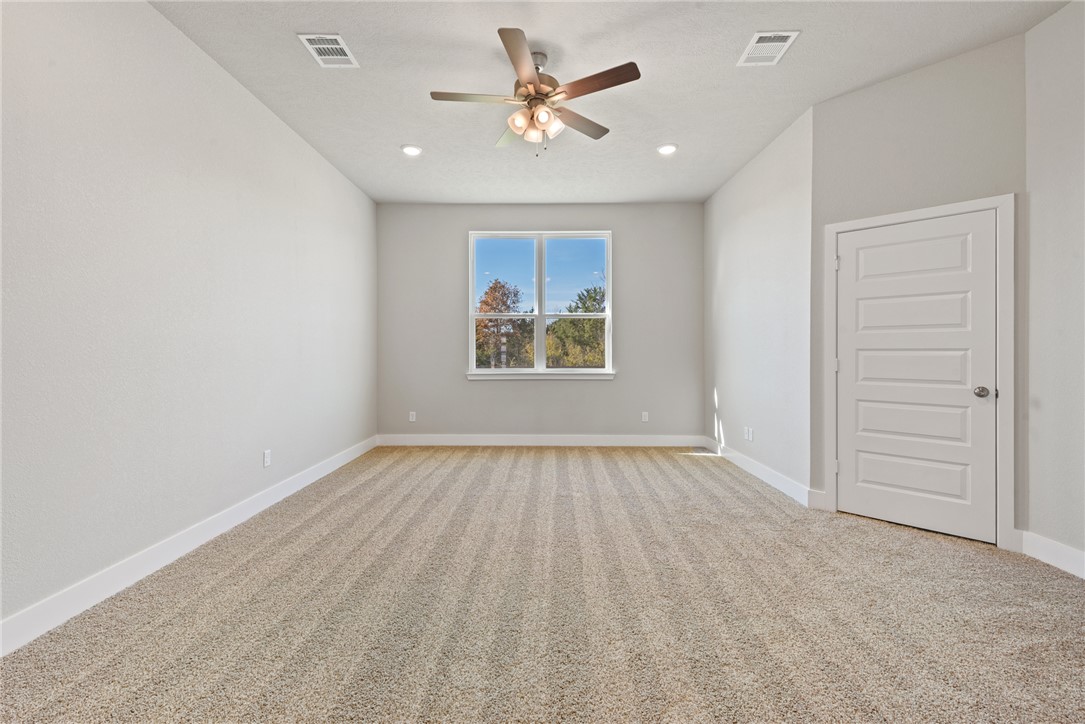 4245 Appalachian Trail Bryan, TX 77802 - Photo 23 of 30 an empty room with closet and windows