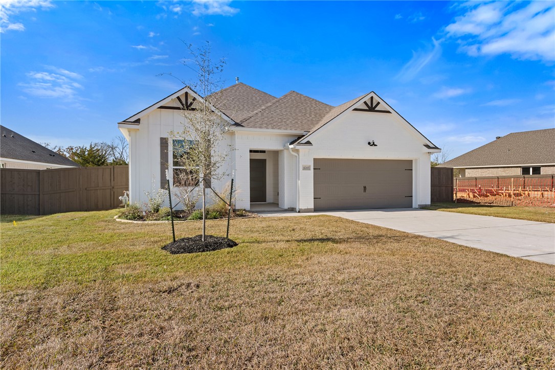 4245 Appalachian Trail Bryan, TX 77802 - Photo 3 of 30 a front view of a house with a yard