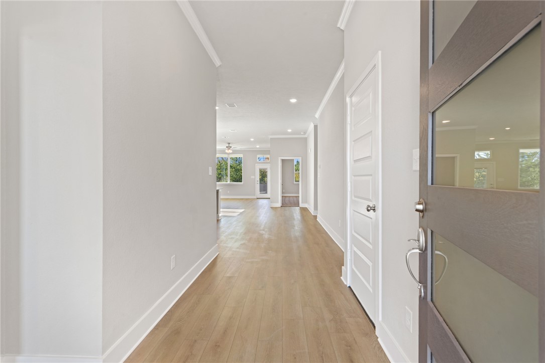 4245 Appalachian Trail Bryan, TX 77802 - Photo 4 of 30 a view of a hallway with wooden floor