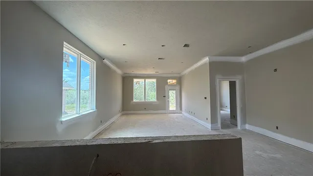 a view of hallway with windows