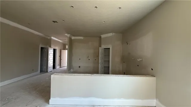 a view of a hallway with an empty room