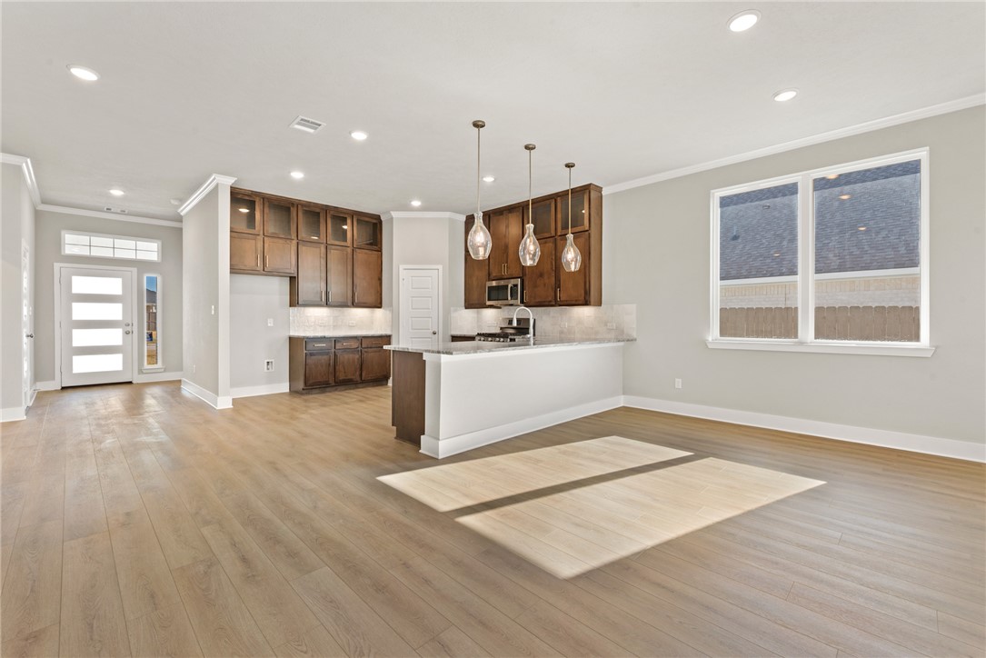 4245 Appalachian Trail Bryan, TX 77802 - Photo 10 of 30 a view of kitchen with cabinets and wooden floor
