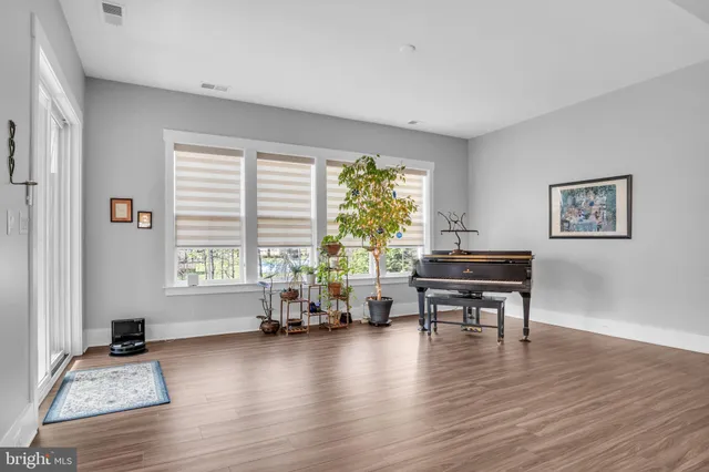 a kitchen with granite countertop a sink appliances and cabinets