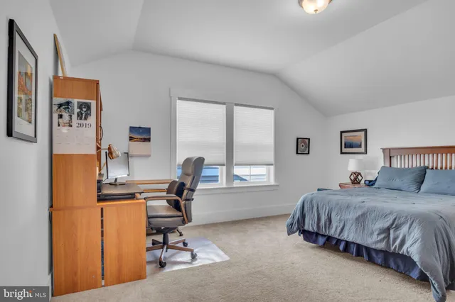 a aerial view of a house with a yard