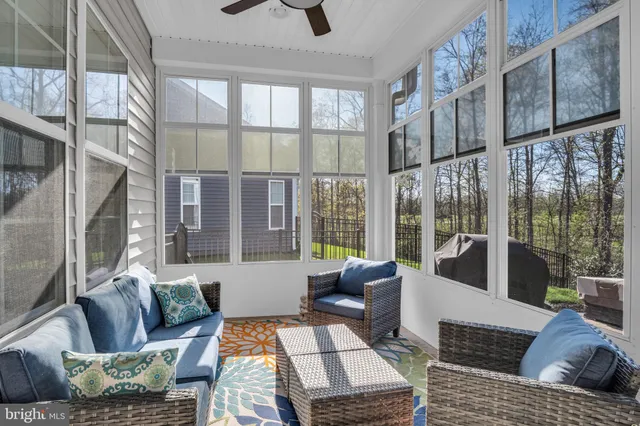 a front view of a house with garden and porch
