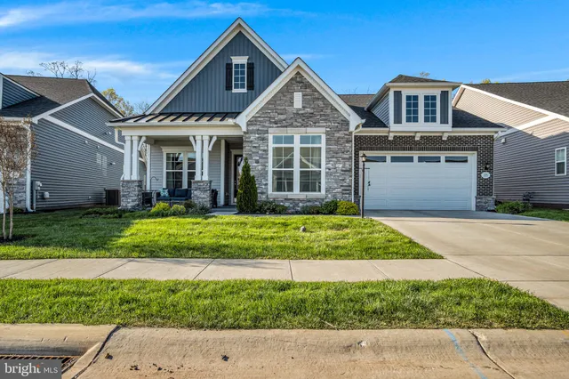 an aerial view of multiple houses with yard
