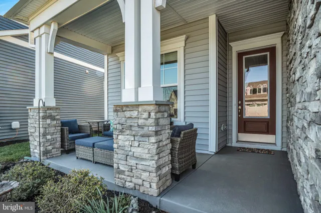 a view of a house with a garden and pathway