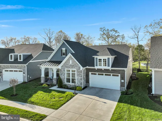 a large dining space with furniture a chandelier and view of living room