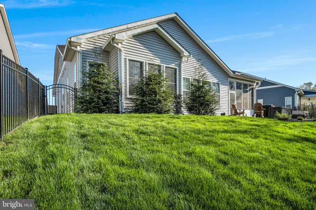 a view of a livingroom with furniture and a large window
