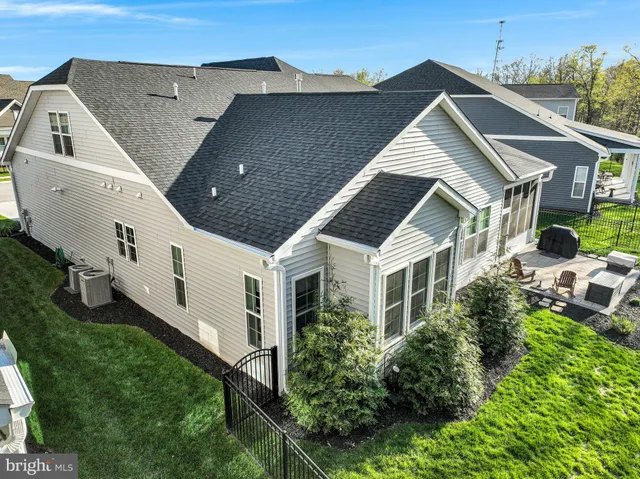 an aerial view of a house with a ocean view
