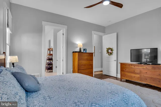 a view of a livingroom with furniture and a flat screen tv