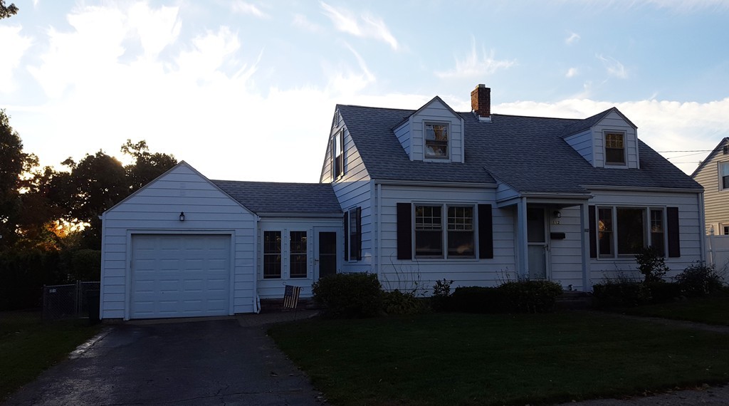 112 Oregon Street Springfield, MA 01118 - Photo 1 of 7 a front view of a house with a yard