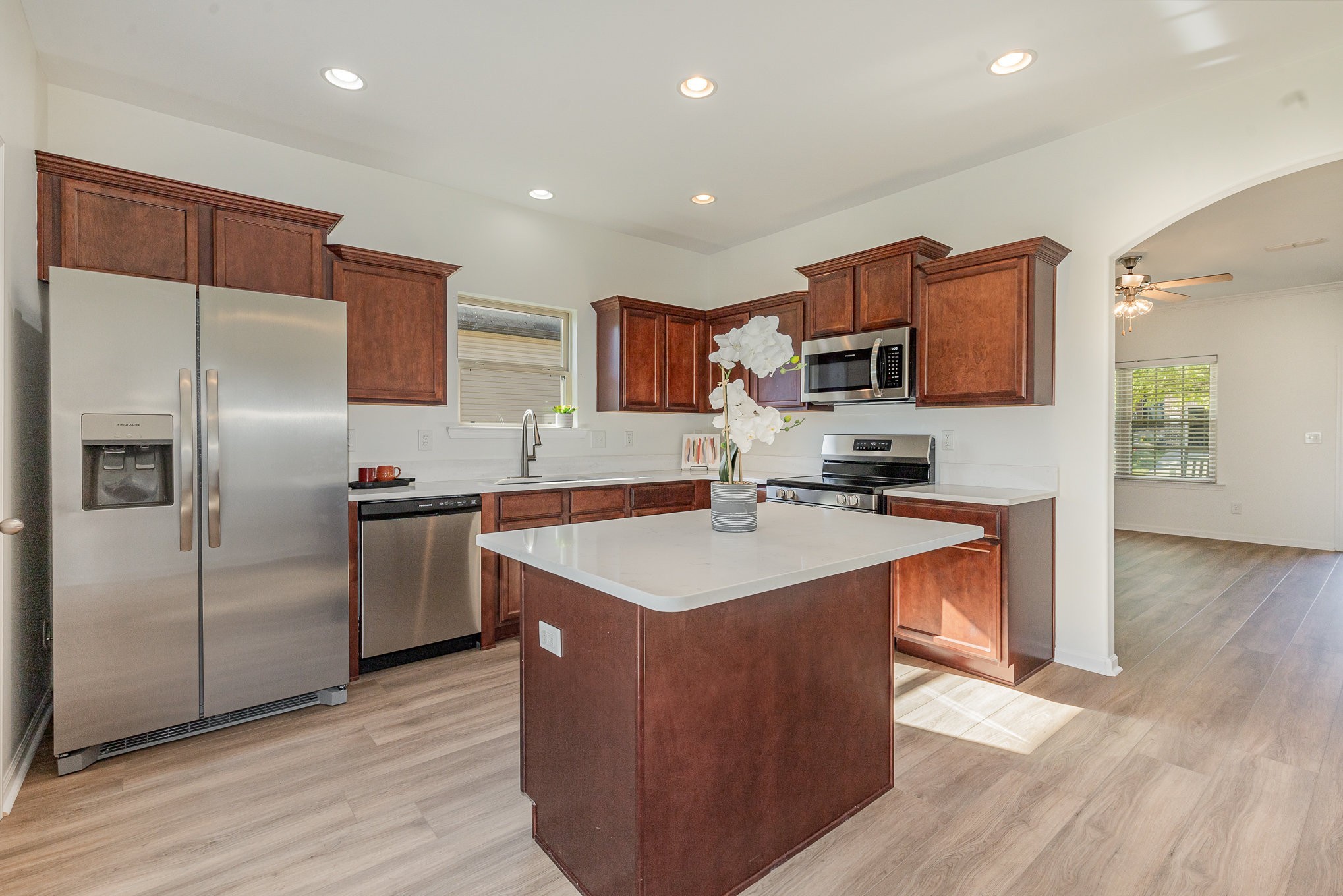 1087 Achiever Circle Spring Hill, TN 37174 - Photo 12 of 39 a kitchen with stainless steel appliances granite countertop a stove top oven a refrigerator and a sink