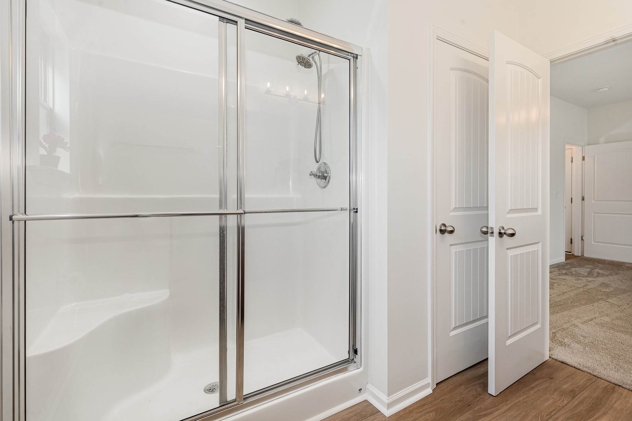 1087 Achiever Circle Spring Hill, TN 37174 - Photo 22 of 39 a bathroom with a glass shower door