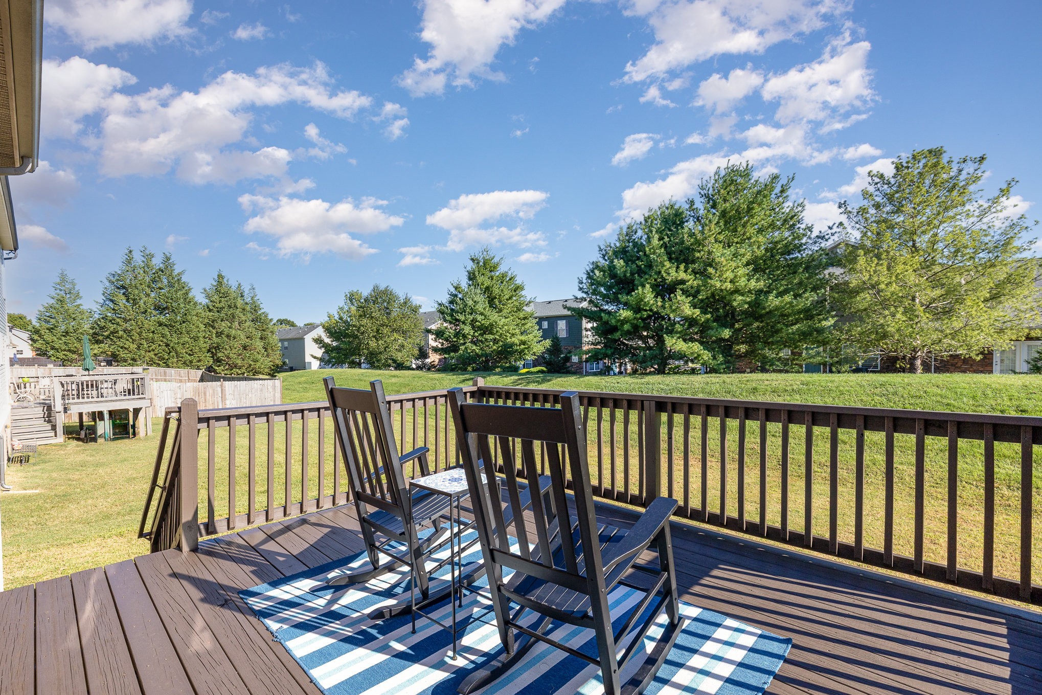 1087 Achiever Circle Spring Hill, TN 37174 - Photo 35 of 39 a view of a balcony with wooden floor and fence