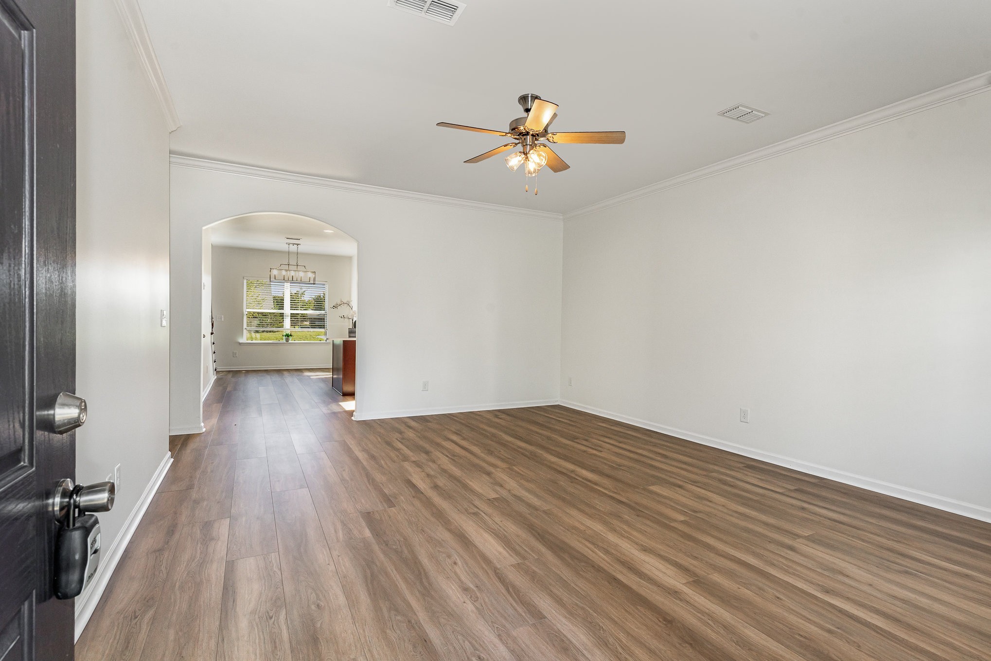 1087 Achiever Circle Spring Hill, TN 37174 - Photo 4 of 39 wooden floor in an empty room with a window