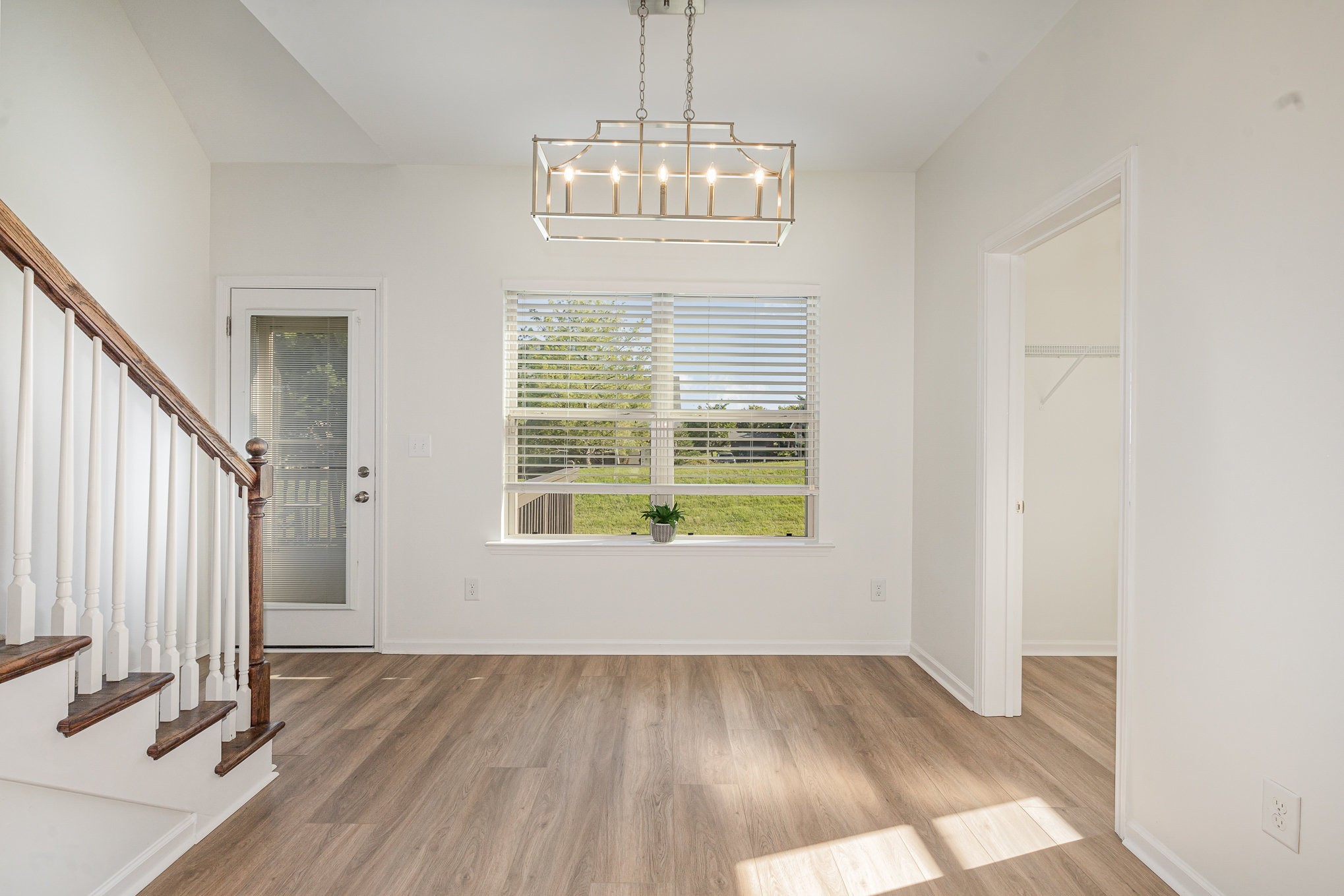 1087 Achiever Circle Spring Hill, TN 37174 - Photo 6 of 39 an empty room with wooden floor and windows