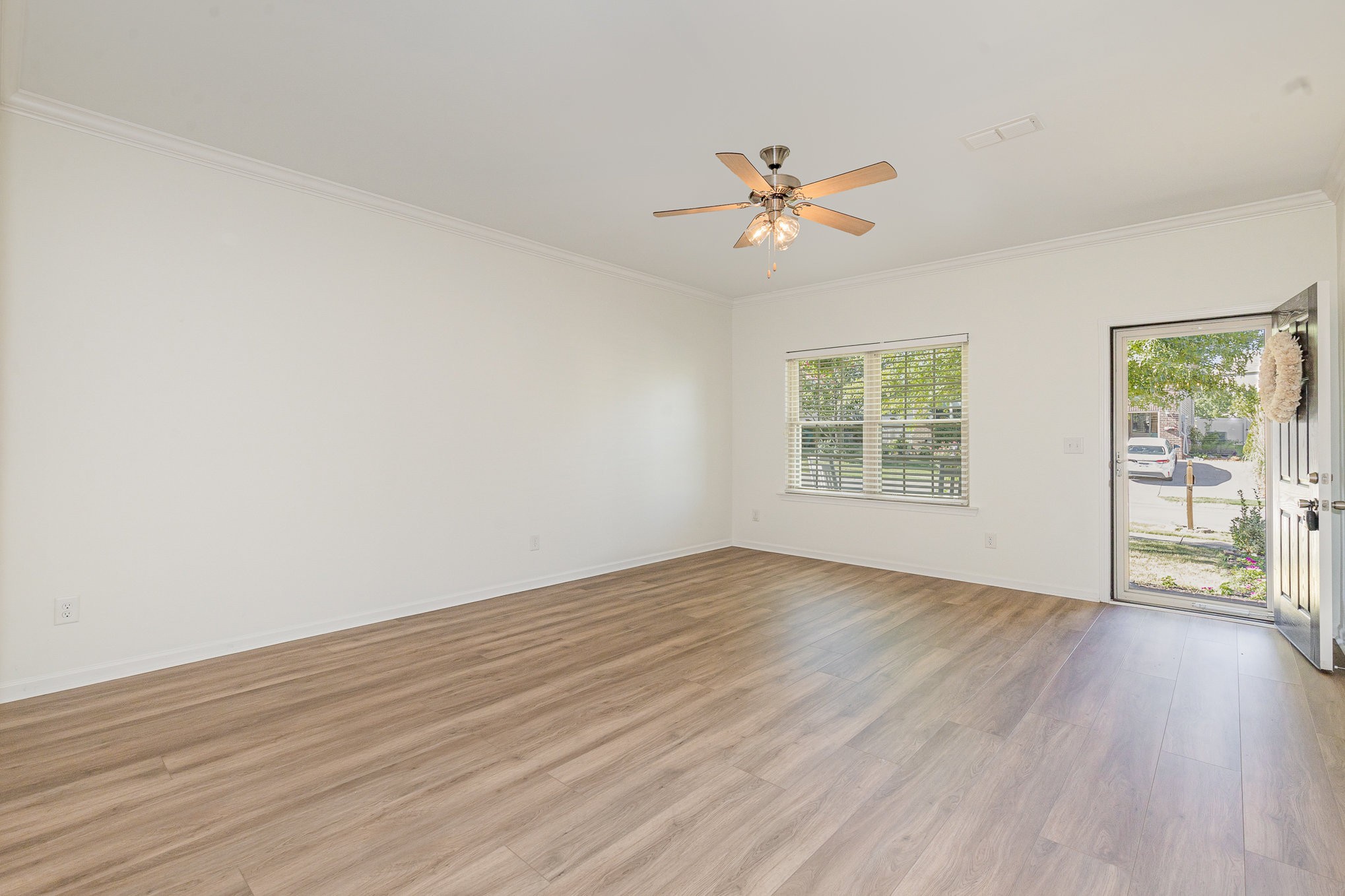 1087 Achiever Circle Spring Hill, TN 37174 - Photo 7 of 39 a view of empty room with wooden floor and fan