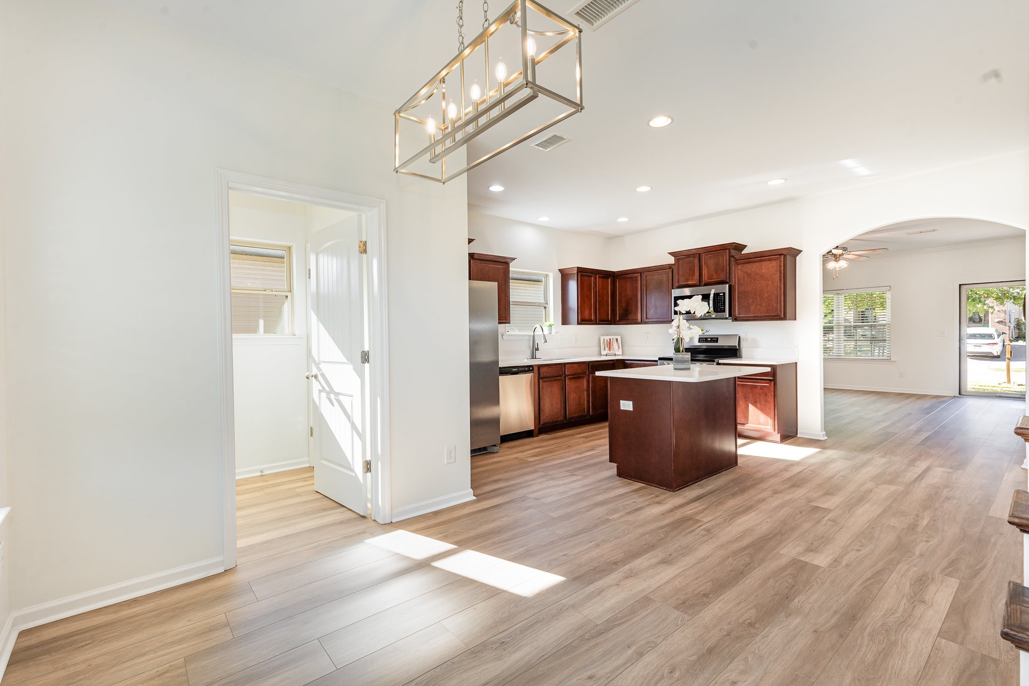 1087 Achiever Circle Spring Hill, TN 37174 - Photo 9 of 39 a kitchen with stainless steel appliances kitchen island granite countertop a stove and a refrigerator
