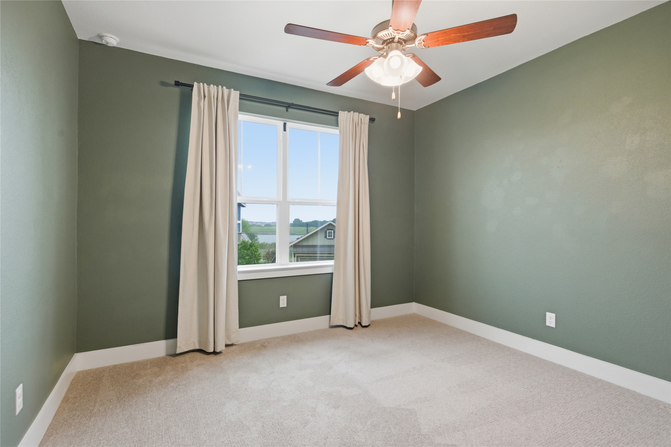 1300 Harwell Loop Kyle, TX 78640 - Photo 12 of 21 an empty room with windows and fan